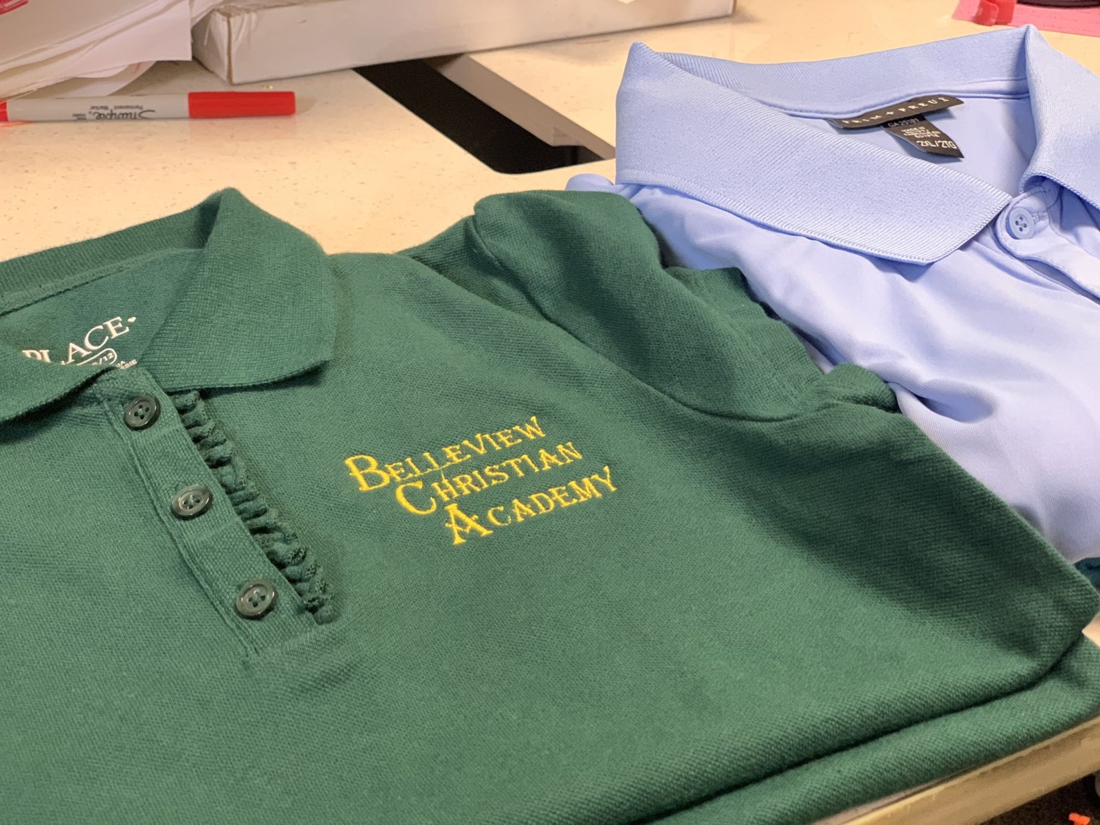 Custom embroidery on a polo shirt for small business.